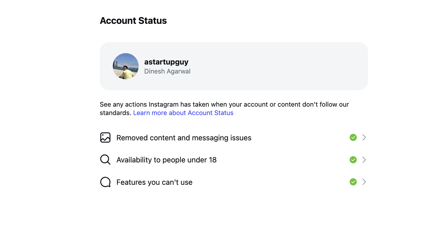 Instagram Account Status screen for the account astartupguy showing three categories, Removed content and messaging issues, Availability to people under 18, and Features you can't use, each marked with a green check